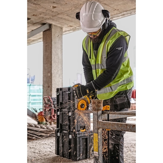 FLEXVOLT MAX Brushless, Cordless Grinder with Kickback Brake grinder being used by a person
